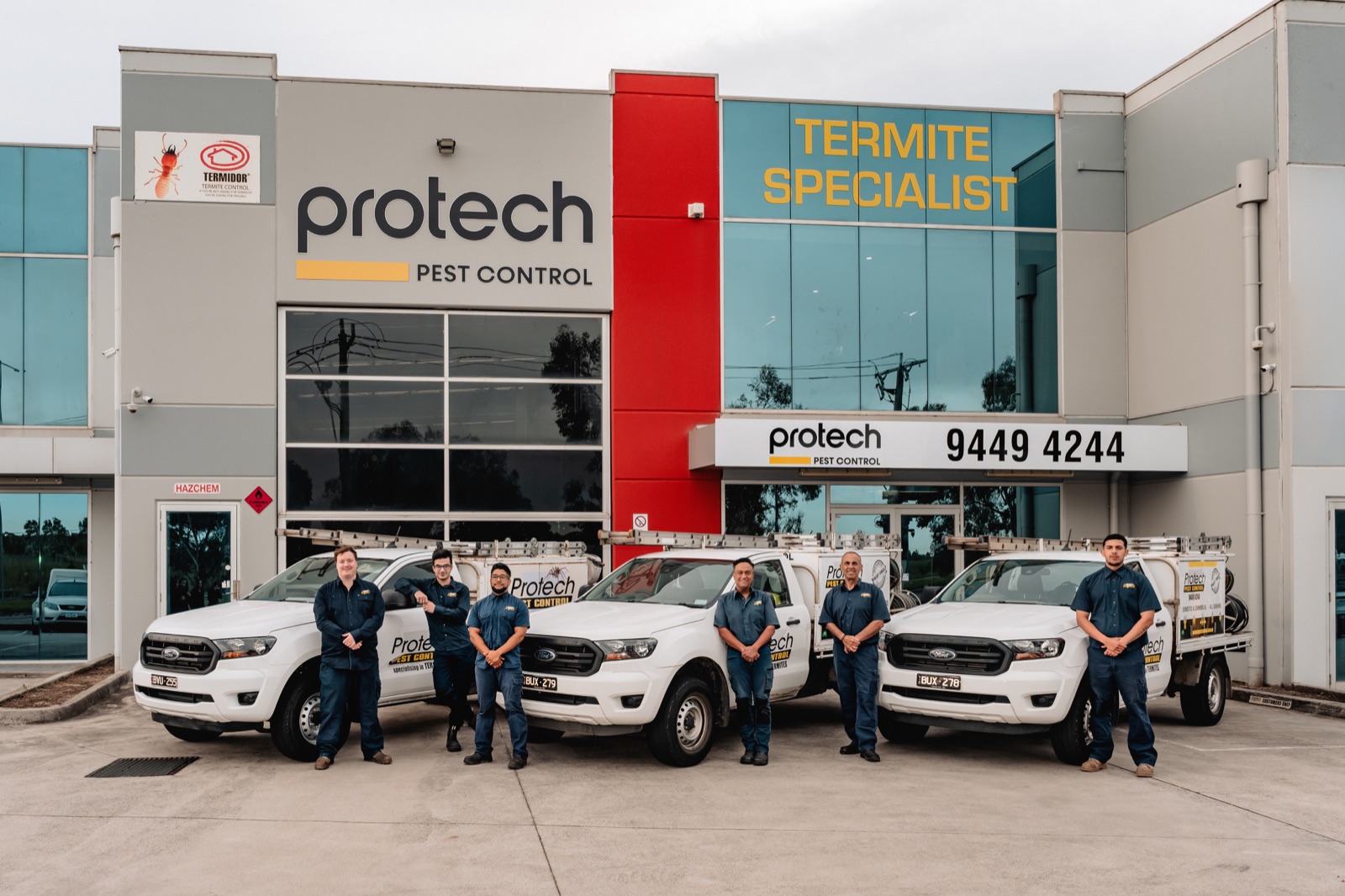 A pest control depot photographed with the full service fleet and team out front