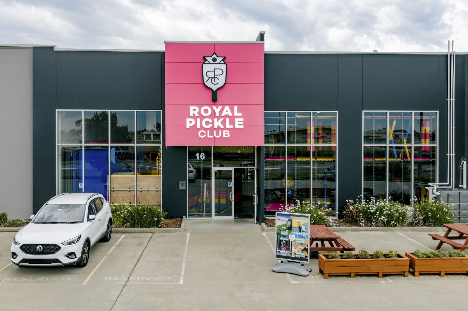 The pink signed entrance and street frontage of Royal Pickle Club