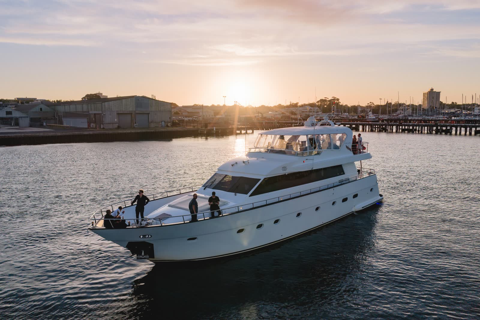 Aerial view of a motor yacht cruising on Port Phillip at sunset