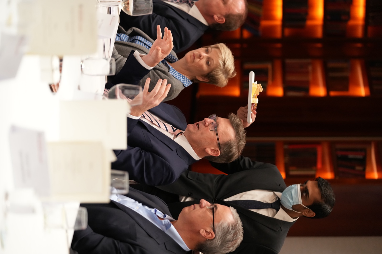 Guests applauding from the floor during a presentation