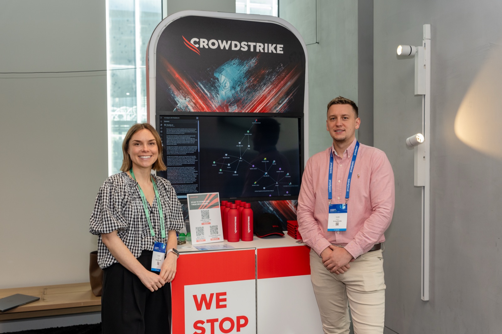 Two delegates at a branded exhibition stand
