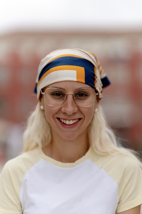 Portrait of a smiling woman in a patterned headscarf, Croatia