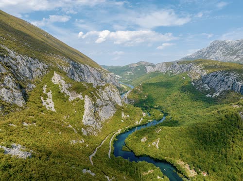 Aerial view of a river winding through a steep limestone gorge, Croatia