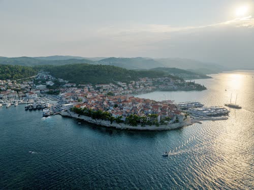Aerial view of the walled old town of Korcula on its peninsula at sunset, Croatia