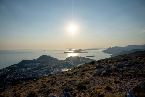 The sun low over the sea and headlands above Dubrovnik, Croatia