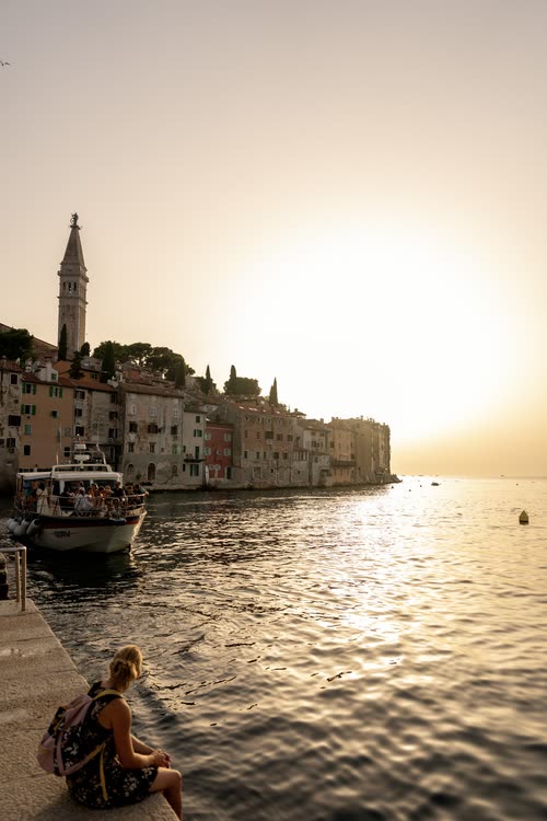The old town of Rovinj silhouetted against the setting sun, Croatia