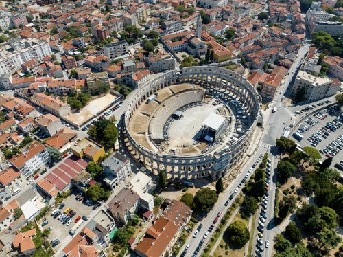 Aerial view of the Roman amphitheatre at Pula surrounded by the town, Croatia