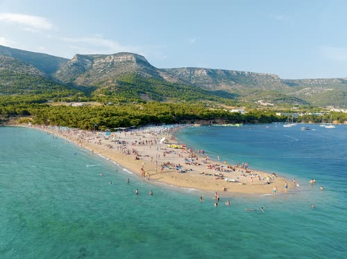 Aerial view of swimmers and boats around the Zlatni Rat beach, Brac, Croatia