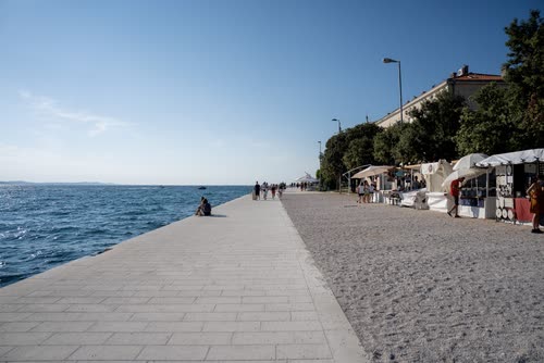 A seafront promenade and market stalls beside the Adriatic, Croatia