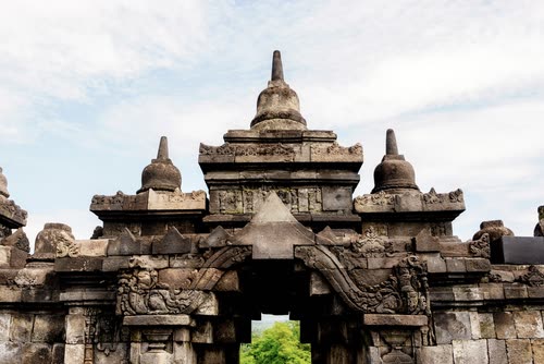 A carved stone gateway on the upper level of Borobudur temple, Java