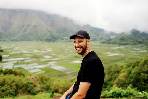 Jordy Scott above a valley of paddy fields below the slopes of Mount Rinjani, Lombok