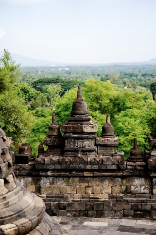 Stupas on the upper terrace of Borobudur above the Javanese forest