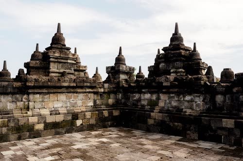 Stupas and carved stone galleries on the terraces of Borobudur, Java