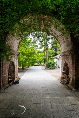 The brick arches of the Nanzen-ji aqueduct with a path running through them