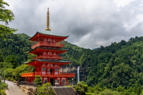 The vermilion pagoda at Nachi above its stone stairway, the falls in the gorge beyond