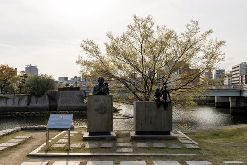 Memorial sculptures beside the river in Hiroshima Peace Memorial Park