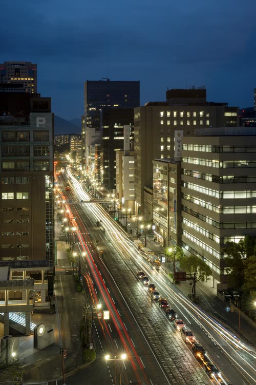 Light trails from traffic running down a Hiroshima avenue at night