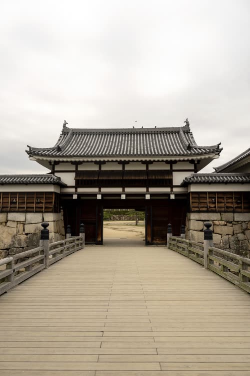 The timber gate and bridge at the entrance to Hiroshima Castle