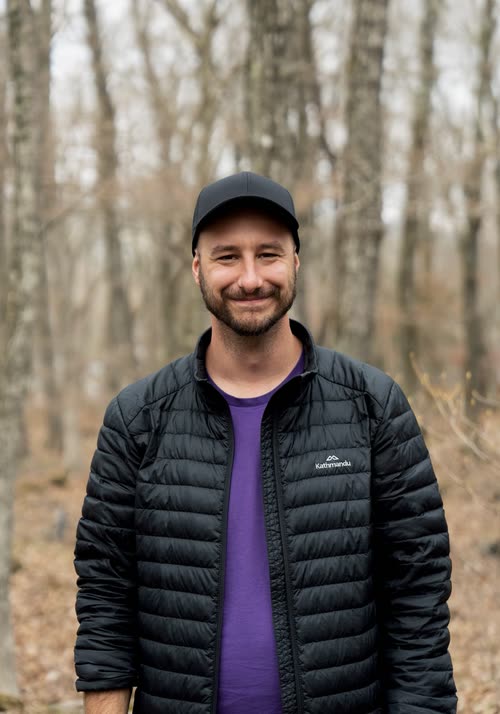 Portrait of Jordy Scott in a bare birch forest in early spring