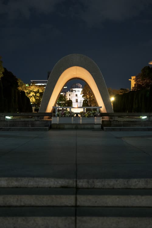 The Memorial Cenotaph lit at night in Hiroshima Peace Memorial Park