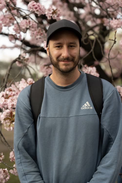 Jordy Scott photographed among cherry blossom in a Japanese park