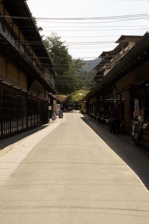 An empty street of traditional timber shopfronts on Miyajima
