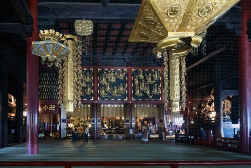 The gilded and lacquered interior of a Japanese temple hall