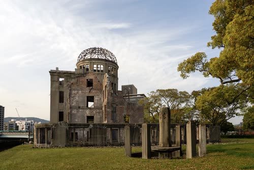 The Atomic Bomb Dome standing above the lawns of Hiroshima Peace Memorial Park
