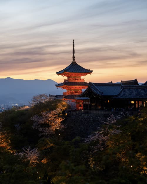 The vermilion Koyasu pagoda at Kiyomizu-dera above the hills at sunset, Kyoto