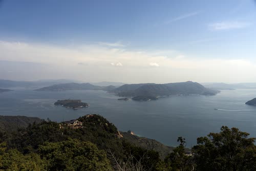 A wide view over the forested islands and channels of the Seto Inland Sea