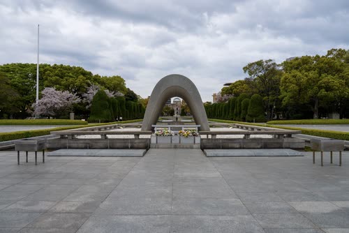 The Memorial Cenotaph framing the eternal flame on the axis of the Peace Park, Hiroshima