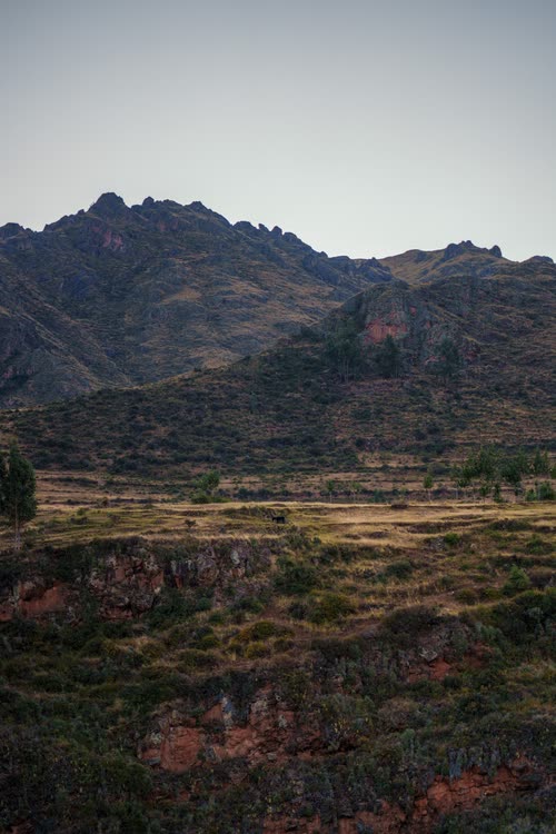 Rocky peaks above terraced ground in the high country outside Cusco