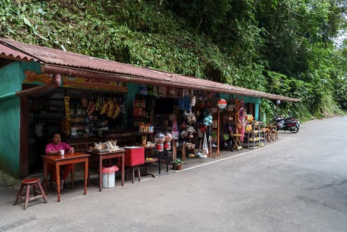 A roadside stall stocked with drinks and snacks on a jungle highway in Peru