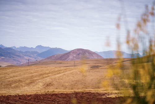 Ploughed fields and rounded hills of the Andean altiplano near Cusco