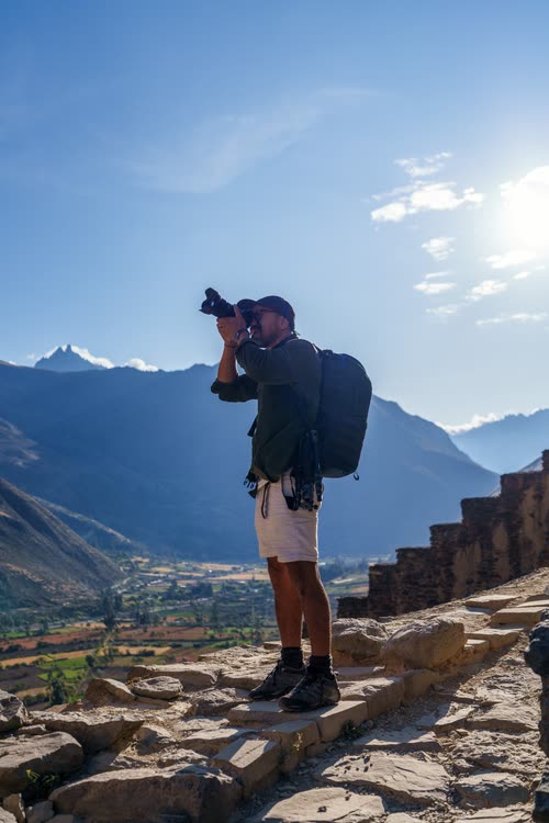 Jordy Scott photographing from the Inca terraces above the Sacred Valley
