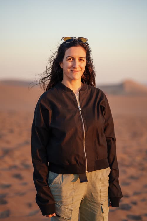Portrait of a woman on the desert dunes at golden hour, Peru