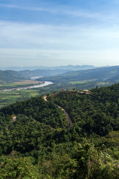 A wide river winding through forested hills in northern Peru