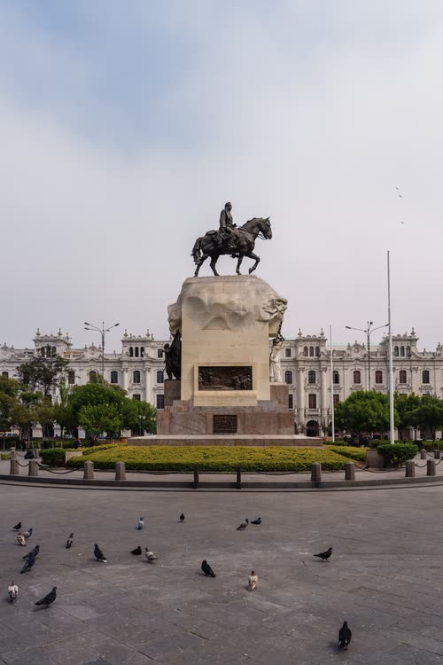 The equestrian monument and colonial facades of the Plaza Mayor, Lima