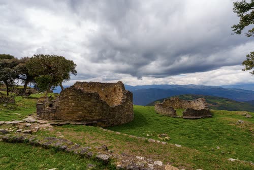 The stone ruins and windswept trees of the Kuelap fortress, northern Peru