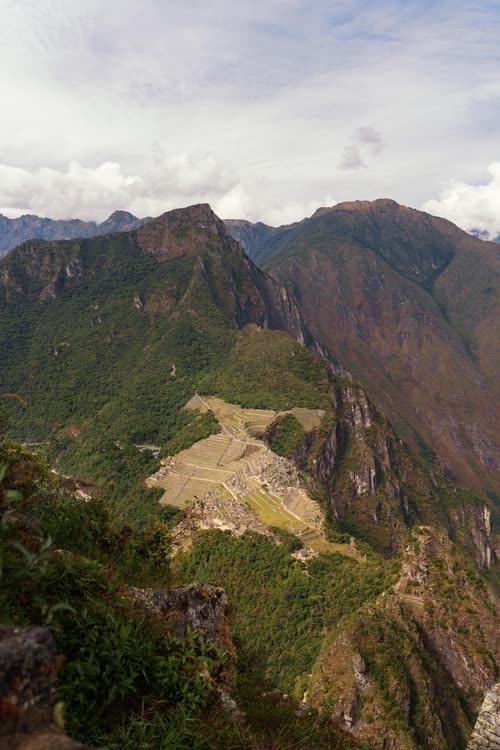 Machu Picchu seen from above with the Urubamba valley falling away behind