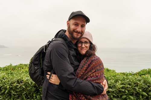 Jordy Scott and a companion on a clifftop above the sea in Lima