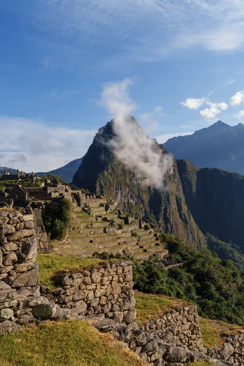 Cloud lifting off Huayna Picchu above the terraces of Machu Picchu, Peru
