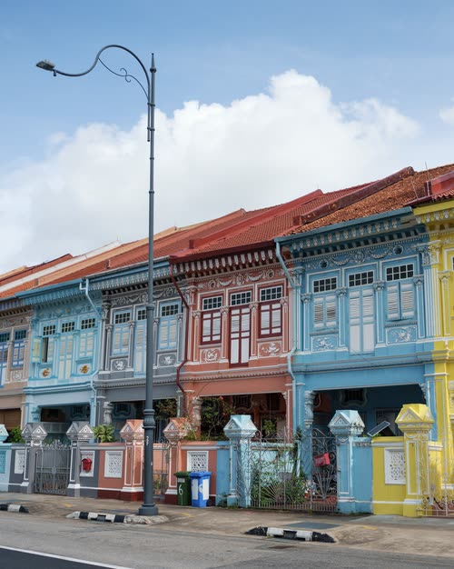 A terrace of restored Peranakan shophouses painted in pastel colours, Singapore