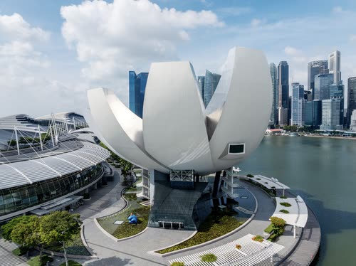 The lotus-shaped ArtScience Museum above Marina Bay with the CBD beyond, Singapore
