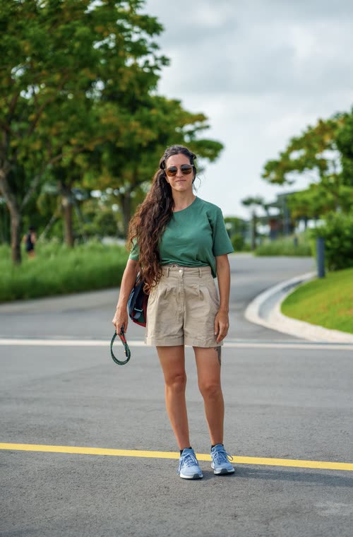 A woman walking a garden path at Gardens by the Bay, Singapore