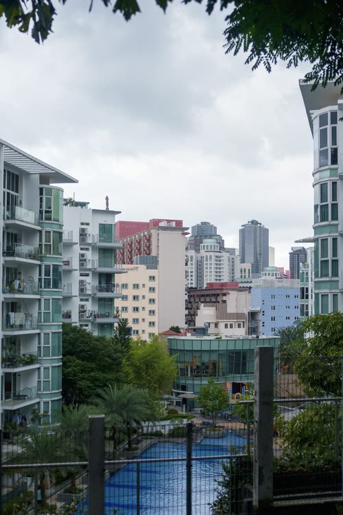 Apartment blocks and a tennis court seen across a Singapore neighbourhood