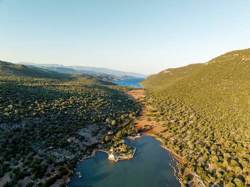 Aerial view of a narrow inlet cutting into scrub-covered hills, Turkey