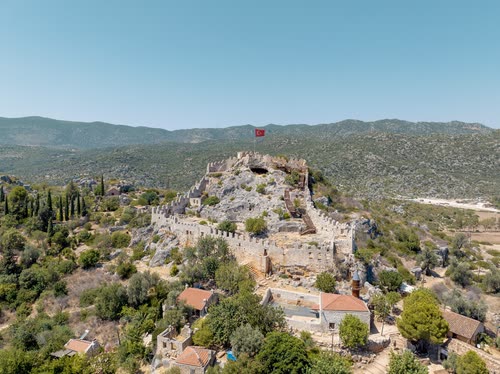 A hilltop castle above the village and shoreline at Kekova, Turkey