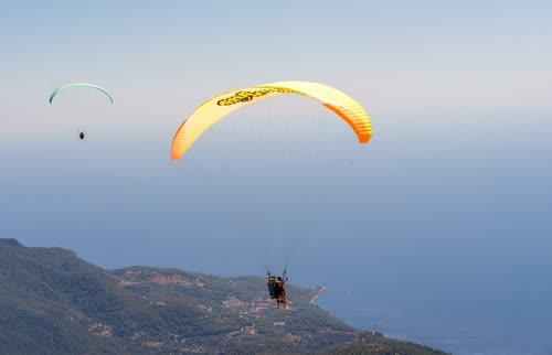 Paragliders soaring above the coast at Oludeniz, Turkey