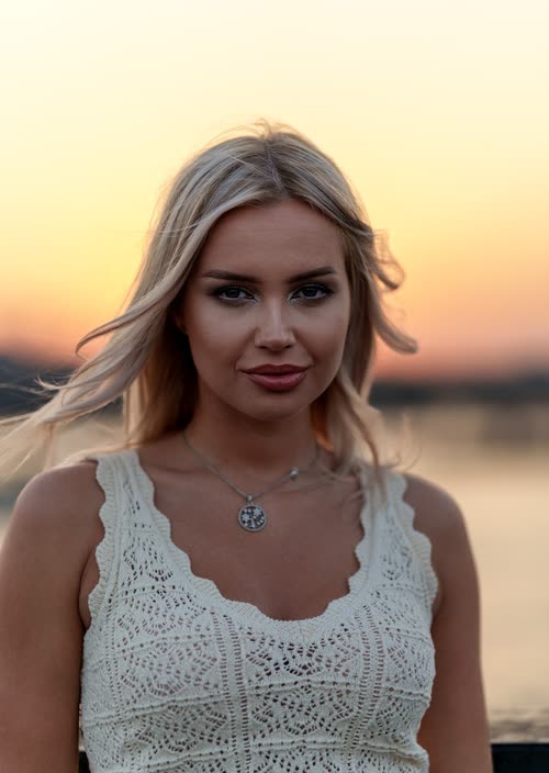 Portrait of a woman at sunset beside the water in Turkey